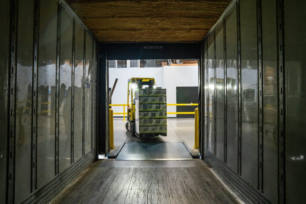 Forklift handling palletized cargo during expert cross-border customs clearance and documentation.